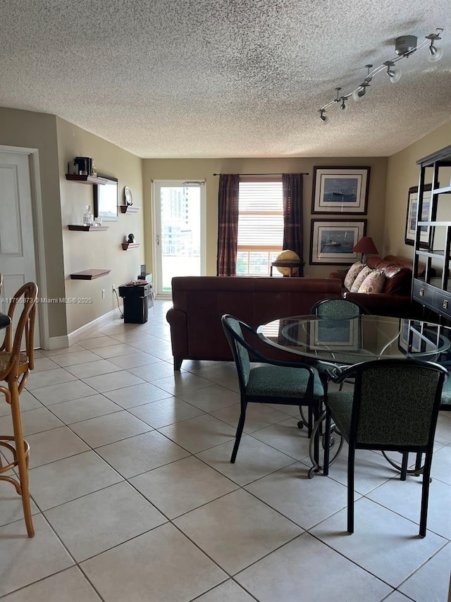 2351 Douglas Rd Unit 1109, Miami, FL 33145 - dining space featuring a textured ceiling and light tile patterned flooring