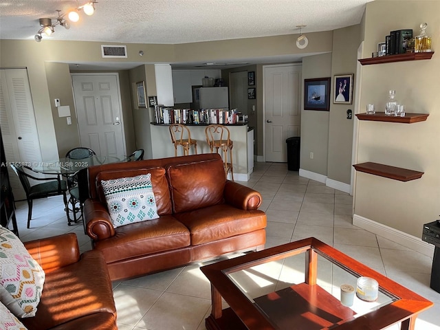 2351 Douglas Rd Unit 1109, Miami, FL 33145 - living room with light tile patterned floors and a textured ceiling