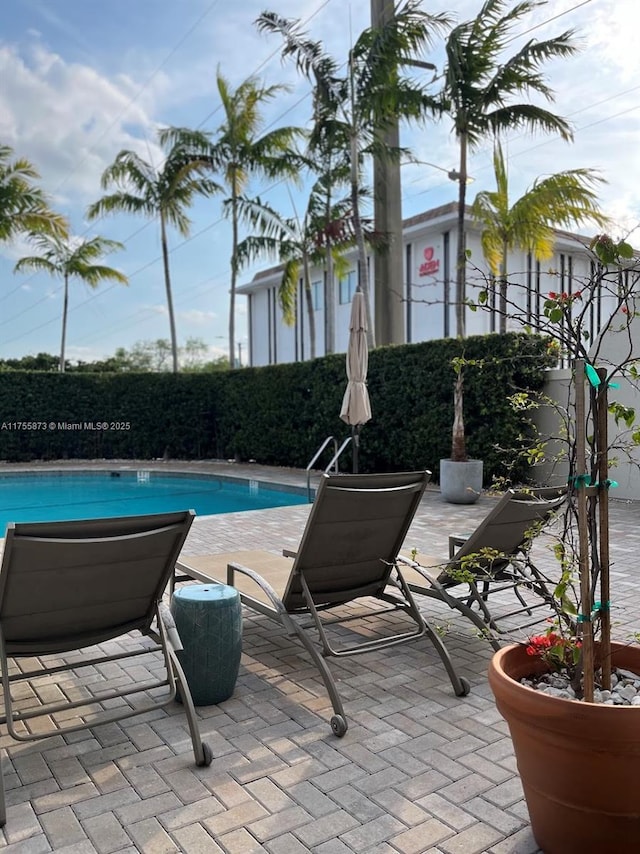 2351 Douglas Rd Unit 1109, Miami, FL 33145 - community pool with a patio area