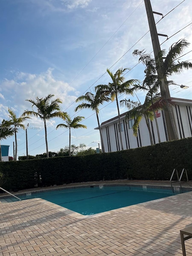 2351 Douglas Rd Unit 1109, Miami, FL 33145 - community pool with a fenced backyard and a patio