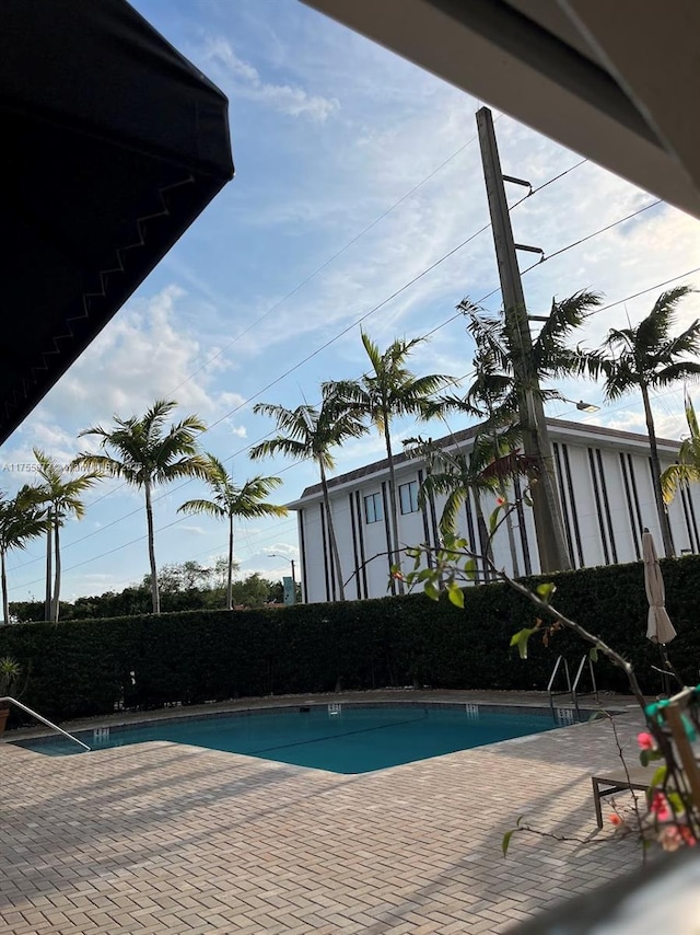 2351 Douglas Rd Unit 1109, Miami, FL 33145 - community pool with a patio area