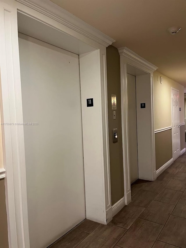 2351 Douglas Rd Unit 1109, Miami, FL 33145 - hallway with elevator and wood finish floors