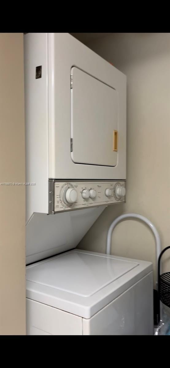 2351 Douglas Rd Unit 1109, Miami, FL 33145 - laundry area featuring stacked washer and clothes dryer