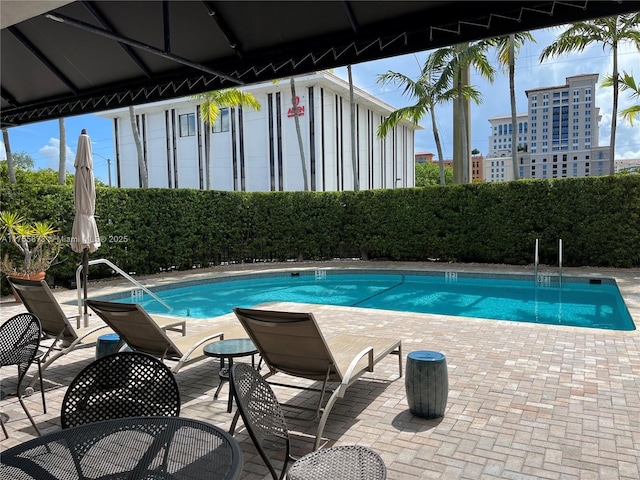 2351 Douglas Rd Unit 1109, Miami, FL 33145 - community pool featuring a patio