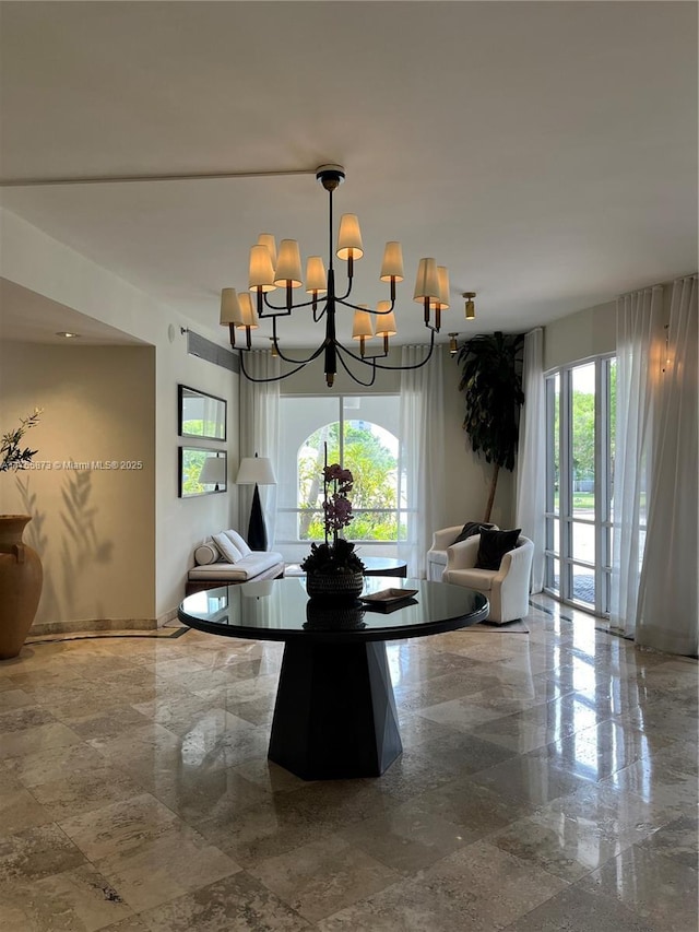 2351 Douglas Rd Unit 1109, Miami, FL 33145 - dining area with a chandelier and baseboards