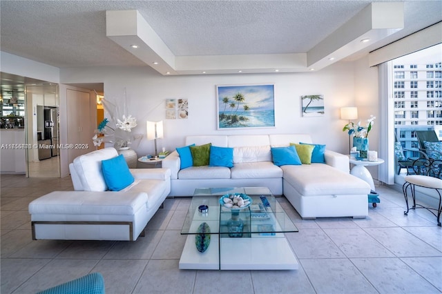 living area with tile patterned floors, a textured ceiling, and recessed lighting