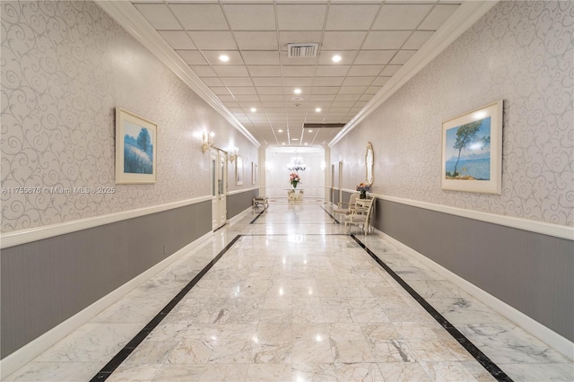 corridor featuring marble finish floor, recessed lighting, wainscoting, and wallpapered walls