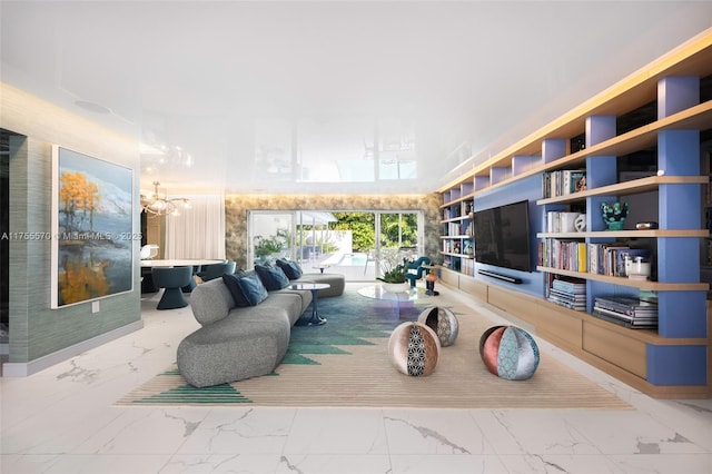 living area with a chandelier and marble finish floor