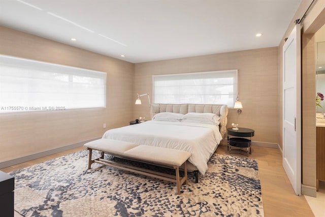 bedroom featuring recessed lighting, baseboards, and light wood-style flooring