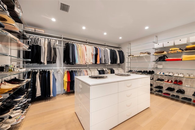 walk in closet featuring visible vents and light wood-type flooring