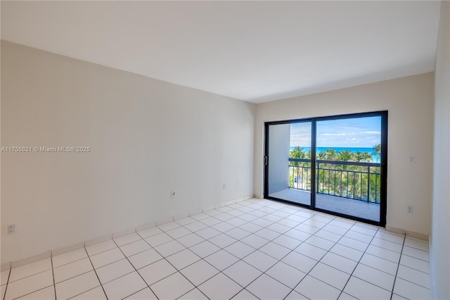 spare room with light tile patterned floors