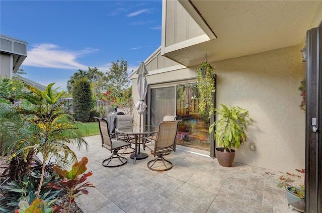 view of patio / terrace with outdoor dining area and fence