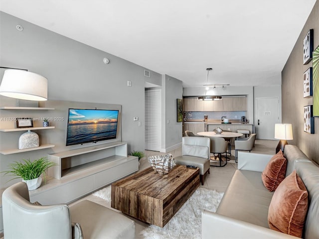 living room with visible vents and light tile patterned flooring