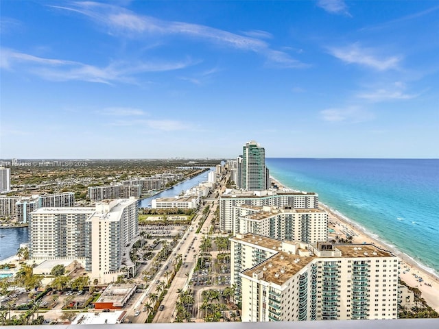 birds eye view of property with a city view and a water view