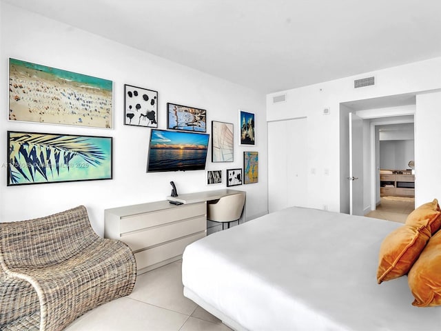 bedroom featuring light tile patterned floors and visible vents