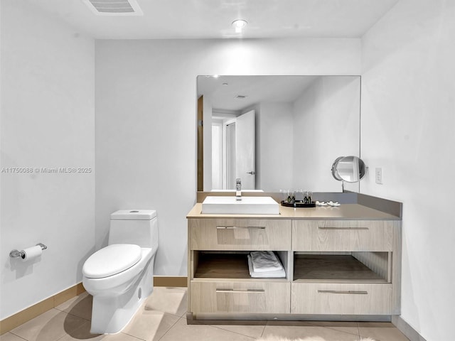 bathroom with visible vents, baseboards, toilet, tile patterned flooring, and vanity