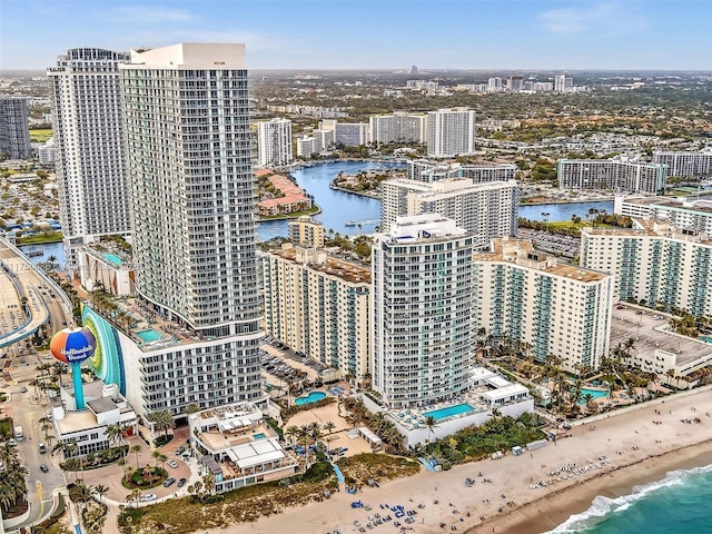 birds eye view of property featuring a view of city and a water view