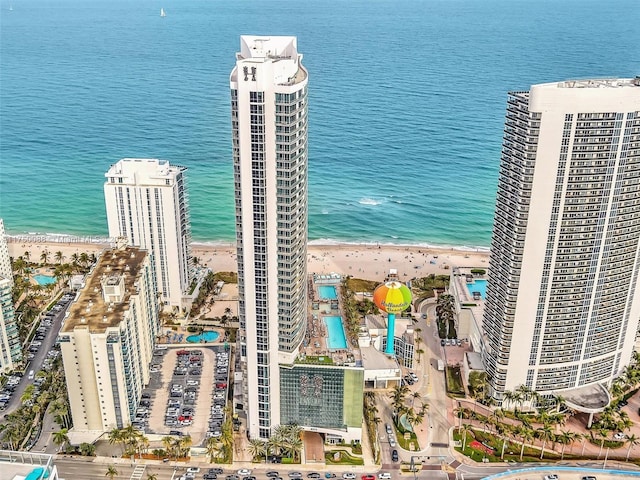 drone / aerial view featuring a water view and a city view