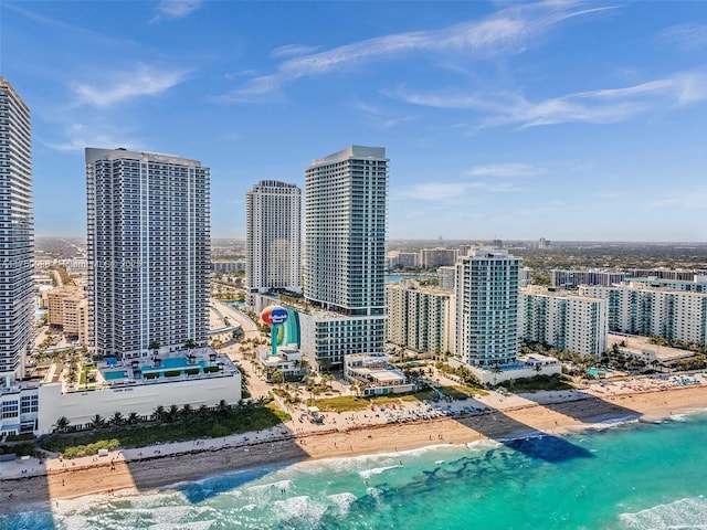 view of city featuring a water view and a view of the beach