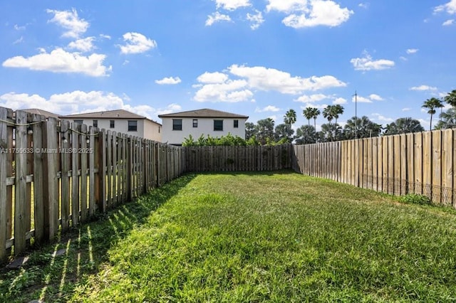 view of yard featuring a fenced backyard