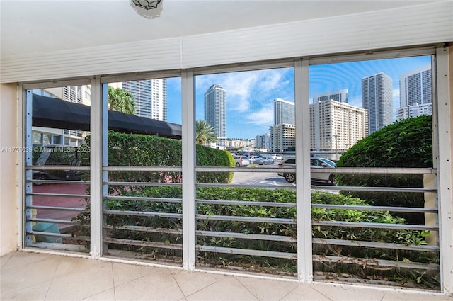 unfurnished sunroom with a view of city