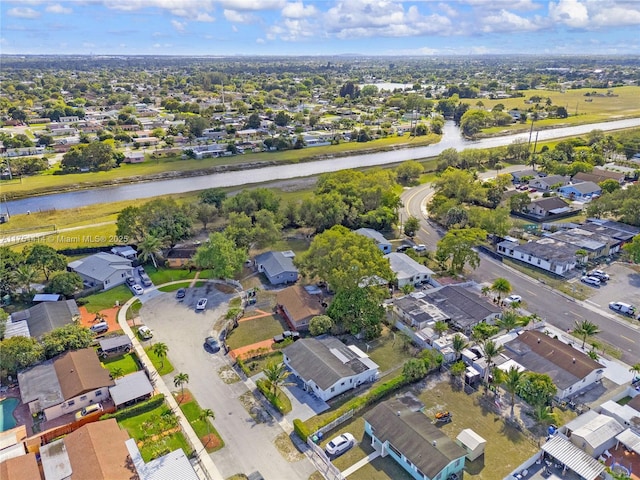 bird's eye view with a residential view and a water view