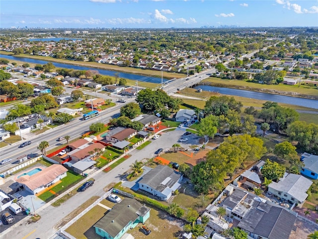 bird's eye view with a water view and a residential view