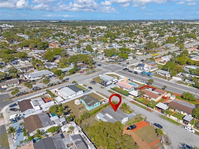 birds eye view of property with a residential view