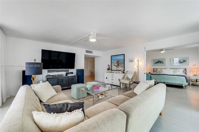 living room with visible vents and ceiling fan