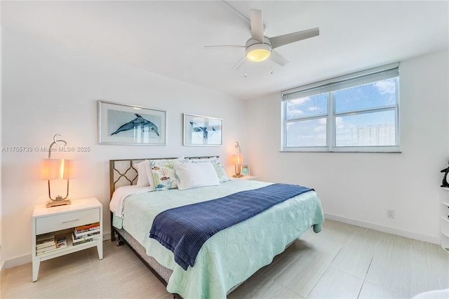 bedroom featuring a ceiling fan and baseboards