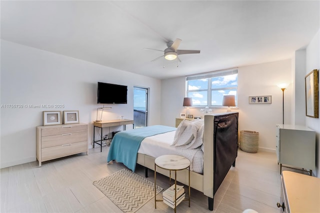 bedroom featuring ceiling fan and baseboards