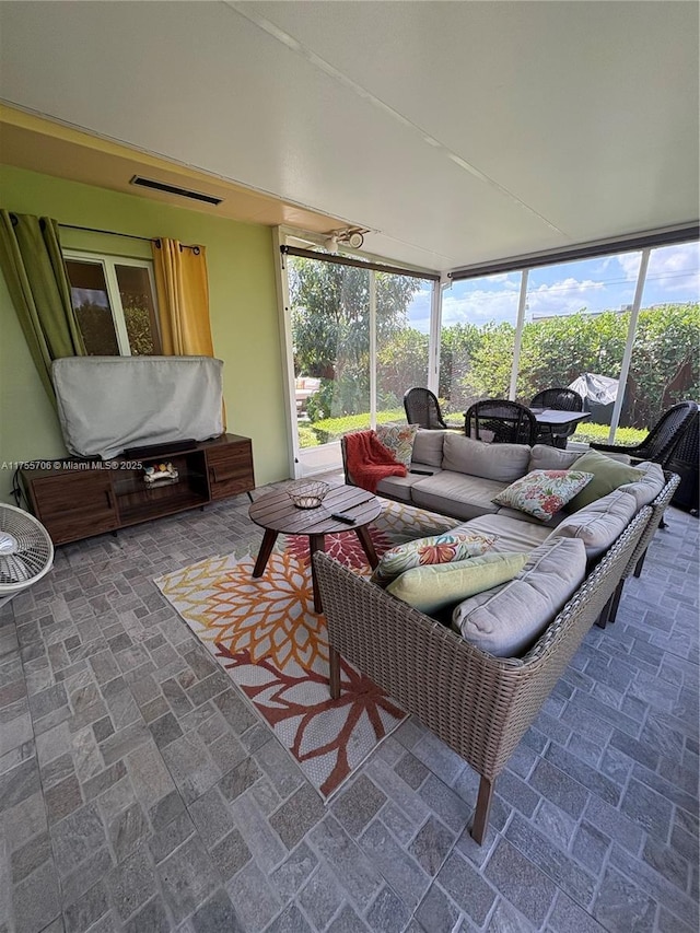 sunroom featuring visible vents