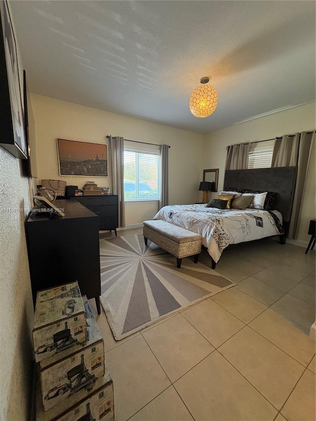 bedroom featuring light tile patterned floors