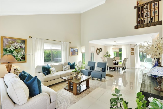 living room featuring light tile patterned floors, a high ceiling, a wealth of natural light, and crown molding