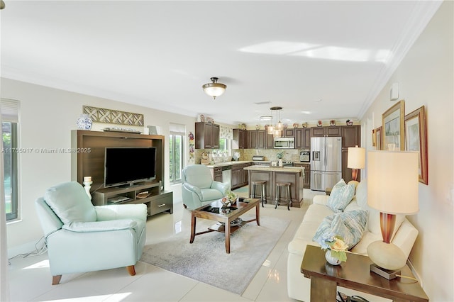 living room with light tile patterned floors and crown molding