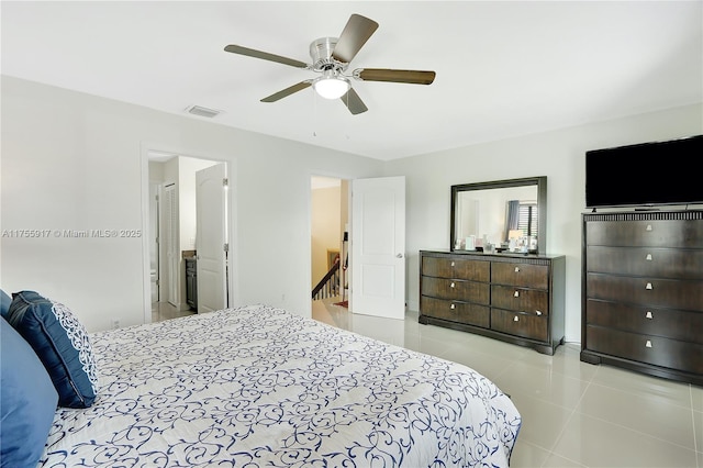 bedroom with tile patterned flooring, visible vents, and ceiling fan