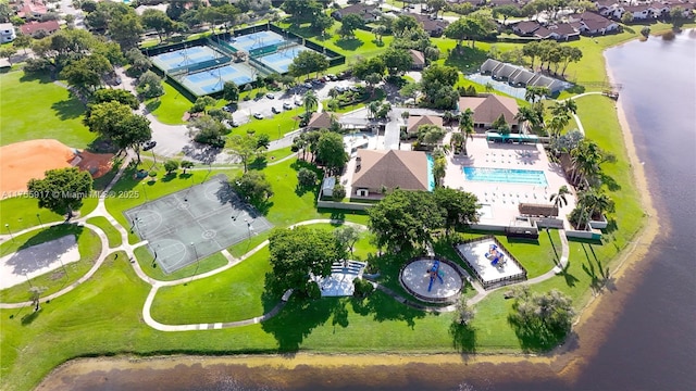 drone / aerial view with a water view and a residential view