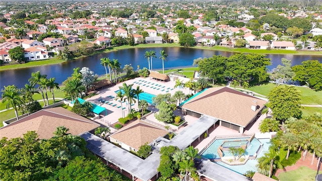 bird's eye view with a water view and a residential view