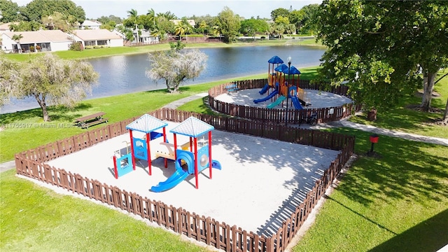 community jungle gym featuring a lawn and a water view