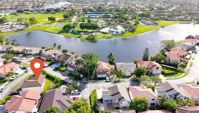 drone / aerial view featuring a water view and a residential view