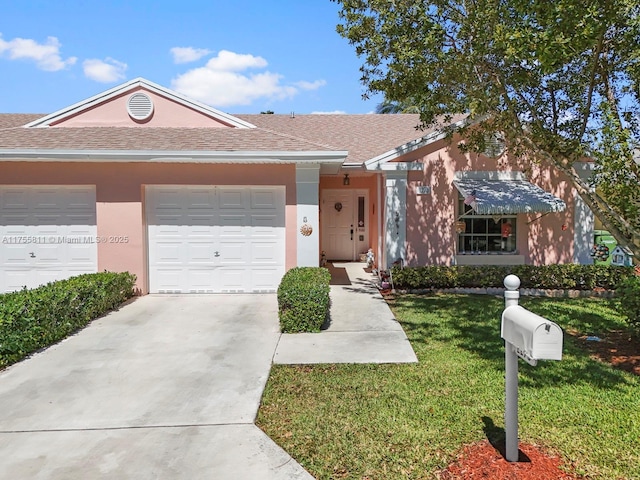 ranch-style home featuring roof with shingles, stucco siding, concrete driveway, a front yard, and a garage