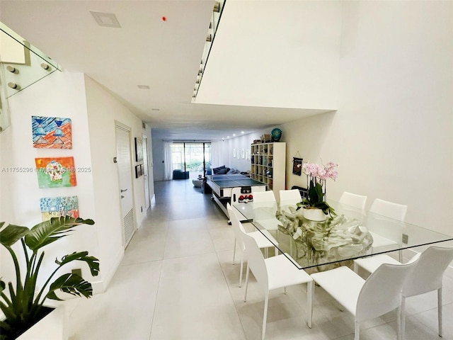 dining space with light tile patterned floors