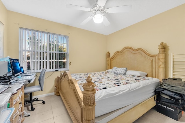 bedroom with light tile patterned floors, baseboards, and a ceiling fan