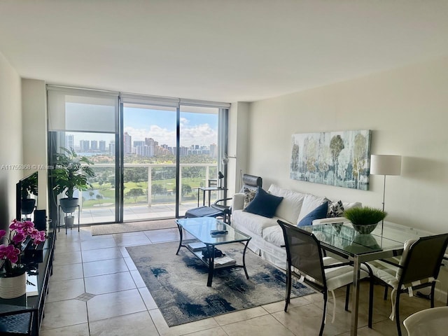 living area featuring expansive windows, light tile patterned floors, and a city view