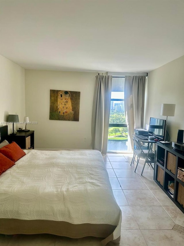 bedroom featuring access to outside and light tile patterned floors