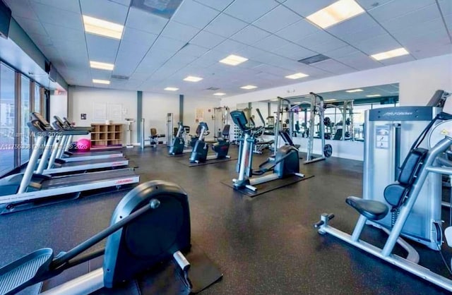 exercise room with a paneled ceiling