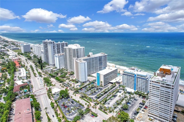 birds eye view of property featuring a water view and a city view