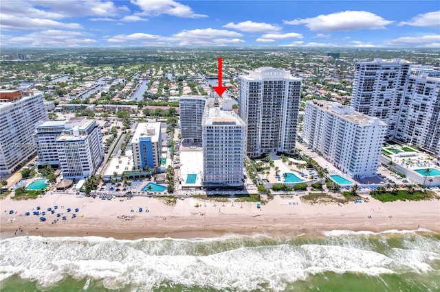 bird's eye view with a view of city, a water view, and a beach view