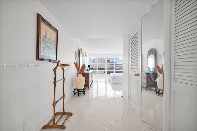 corridor with light tile patterned floors