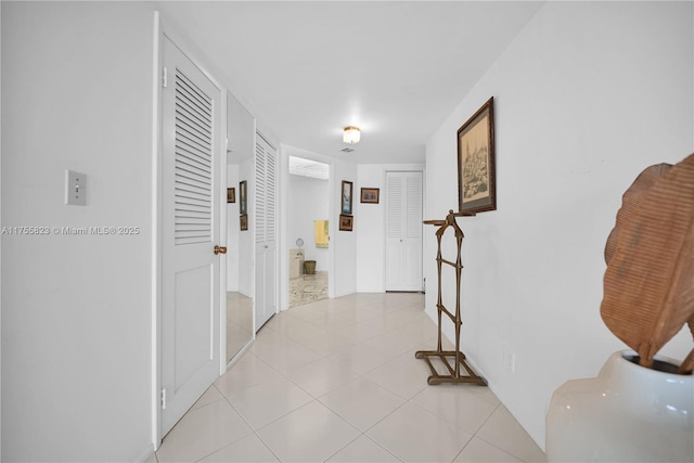 hallway featuring light tile patterned floors